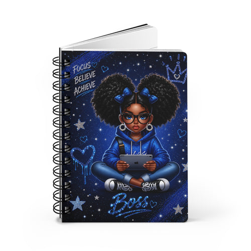 Black spiral notebook with blue galaxy-style girl illustration and motivational text on cover