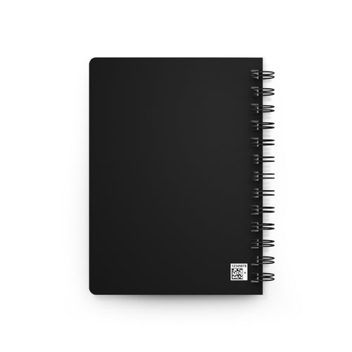 Black spiral notebook with blank front cover and metal coil binding